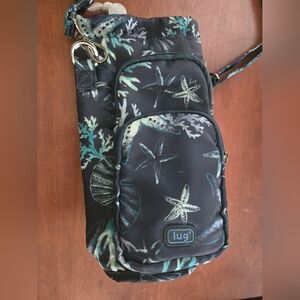 Lug Huggie Navy Crossbody Bag Insulated Water Bottle Bag Sea shellls Park Walk